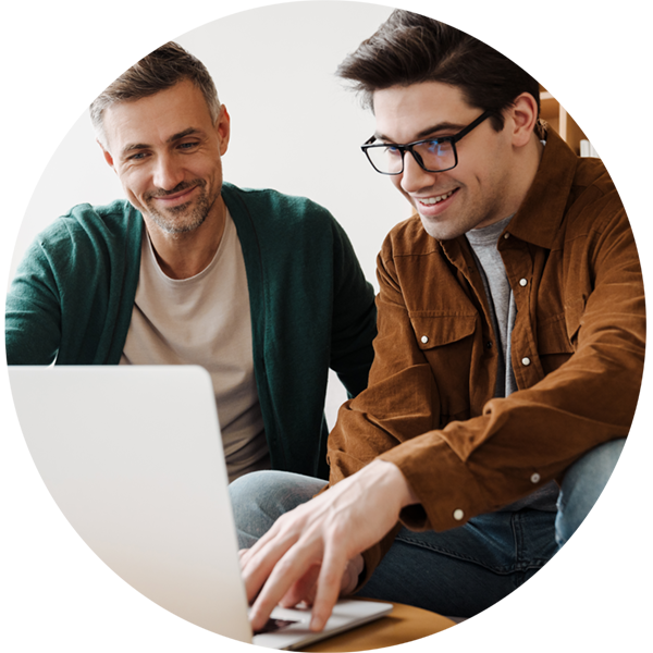 Two Men Looking at Laptop