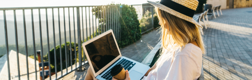 Young_Woman_On_Laptop_On_Park_Bench