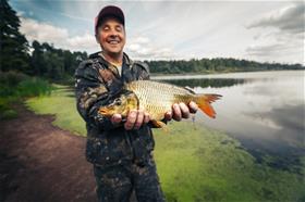 Fisherman_Holds_Catch