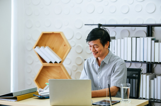 Man_Views_Computer_In_Office