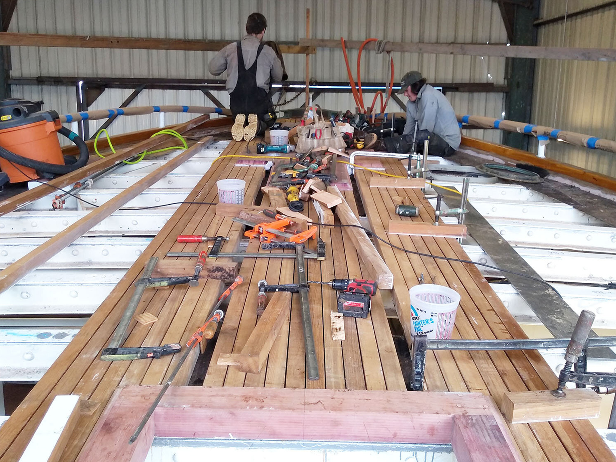 Haven Boatworks crew finishing a ship deck