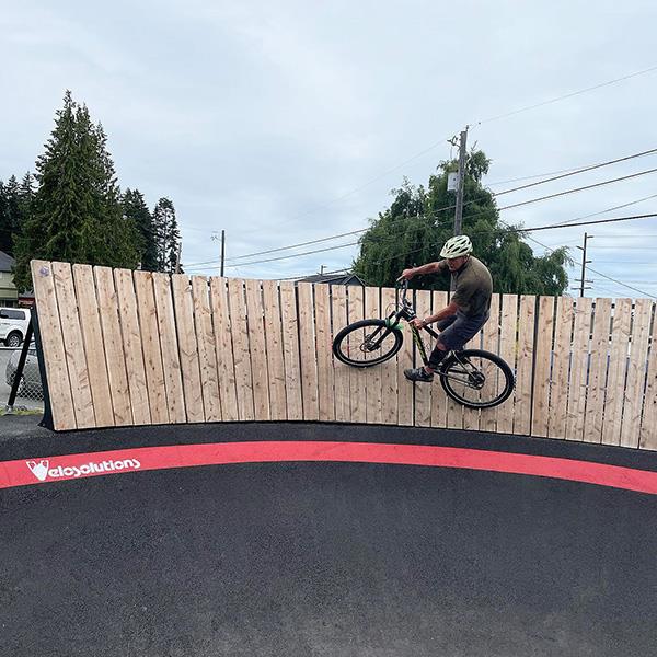 man on pump track wall ride