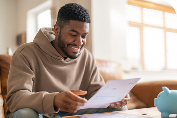 Man Smiling at Document